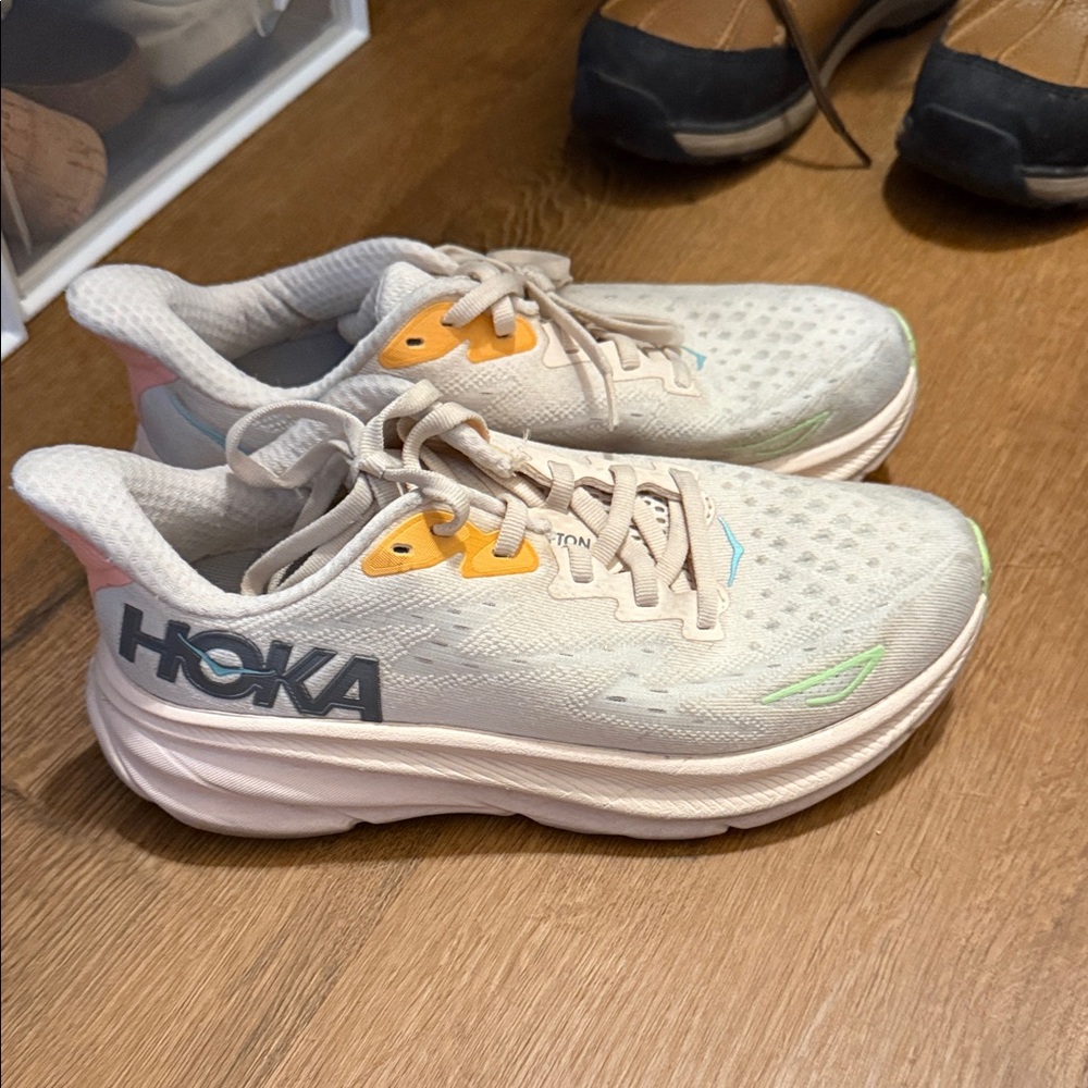 Hoka Cream and Orange Athletic Shoes